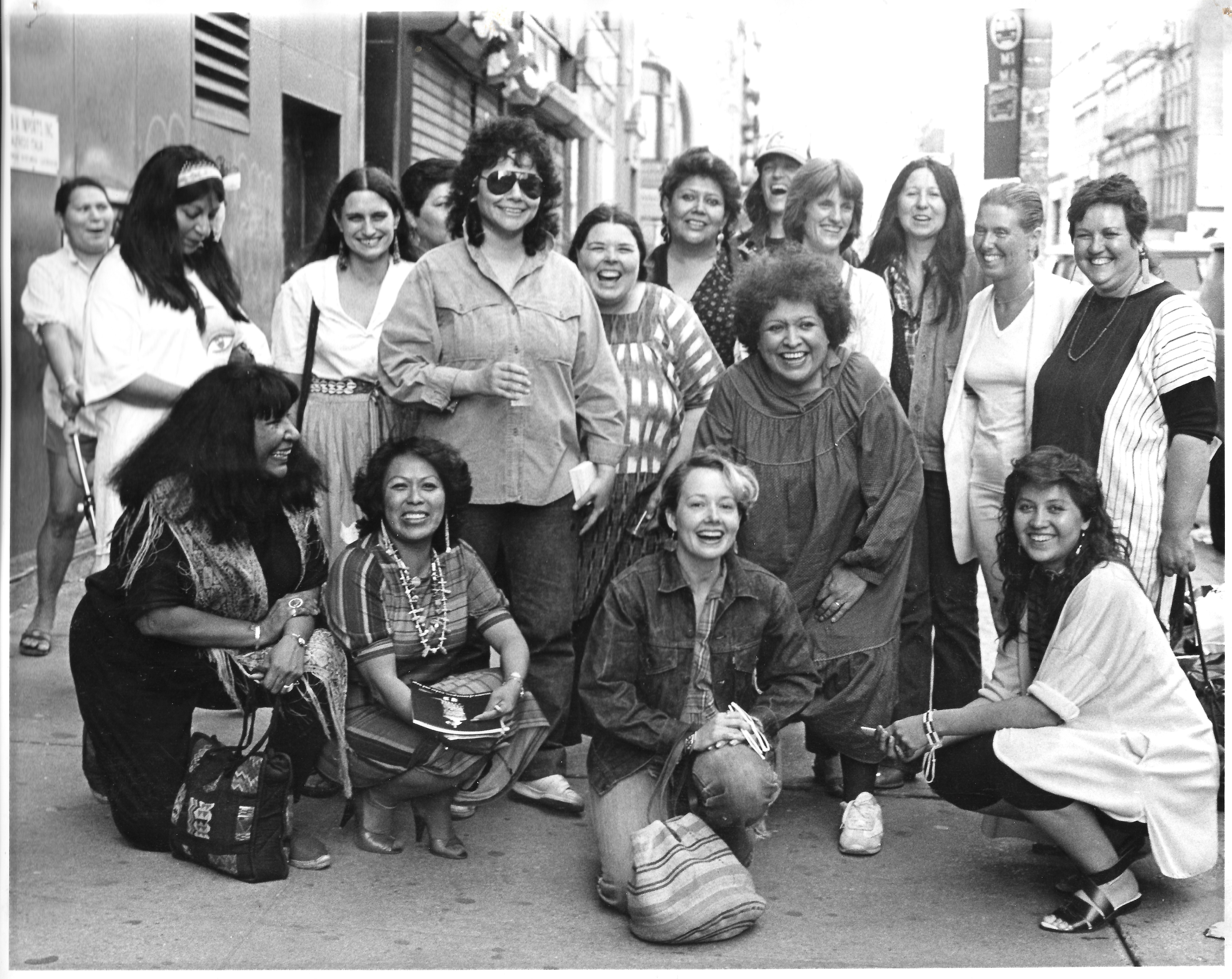 From the exhibition, "Women of Sweetgrass, Cedar and Sage," friends and community members outside the American Indian Community House Gallery, 1985. Photo by Jesse Cooday.