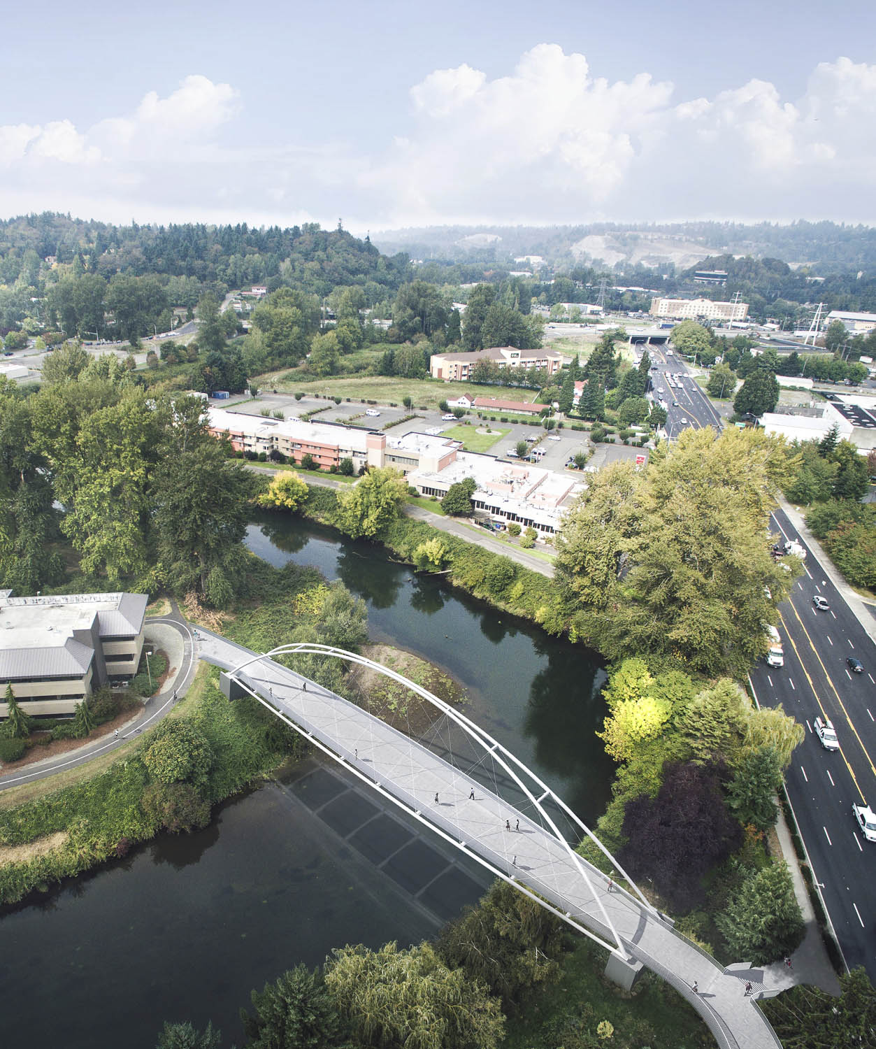 The new Tukwila Urban Center Bridge adjacent to Bicentennial Park crossing the Green River in Tukwila, a suburban city bordering Seattle at its northern edge. Image copyright Adam Hunter/LMN Architects.