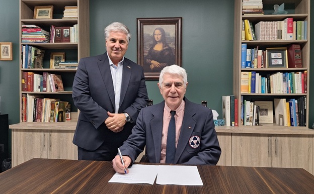 Marco DeVuono, President and CEO, Villa Charities Inc. (L) and Dom Tassielli, Co-Founder, Leonardo Da Vinci Academy of Arts & Sciences (R) co-sign the new affiliate agreement.