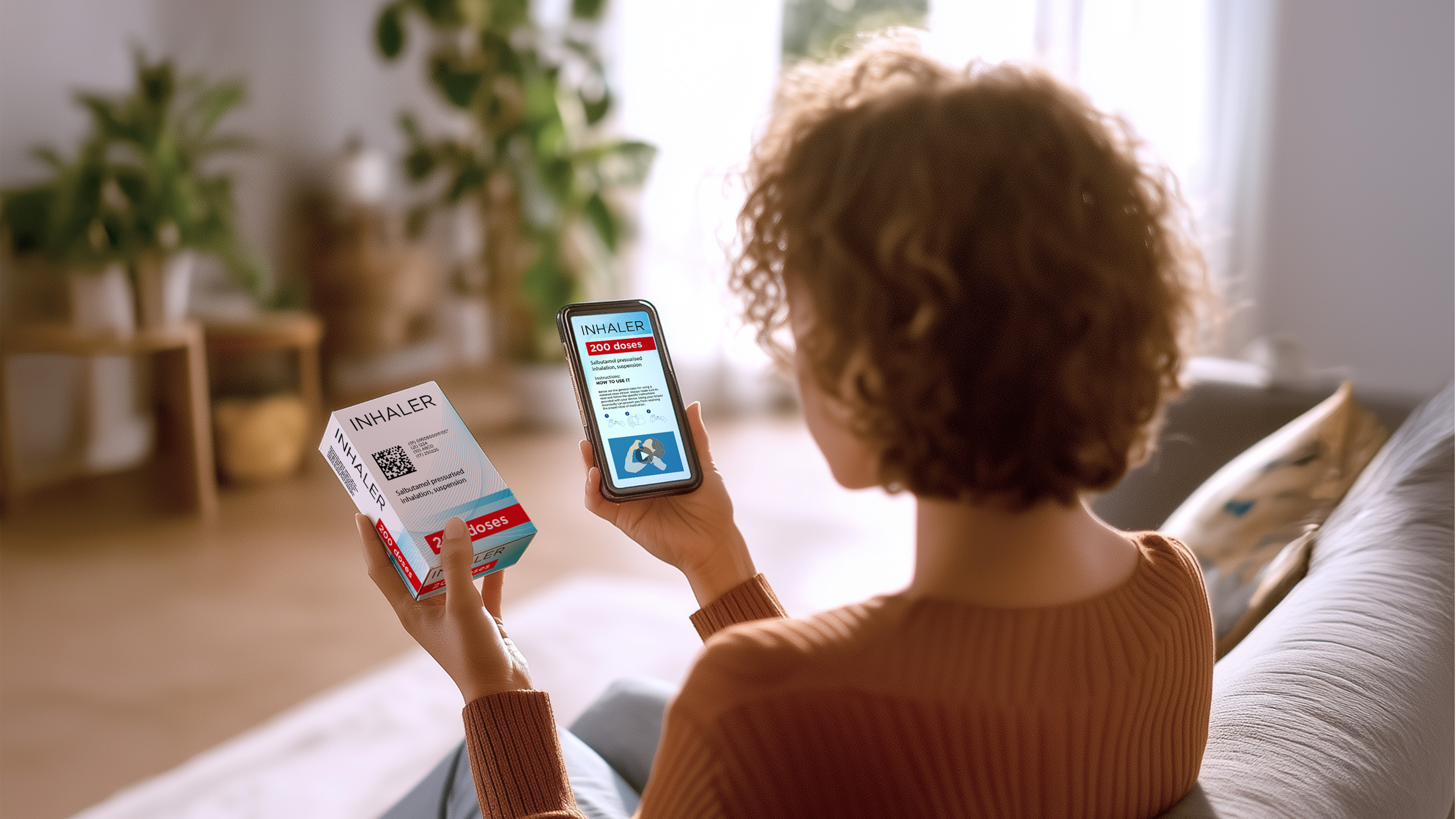 Human holding phone and box