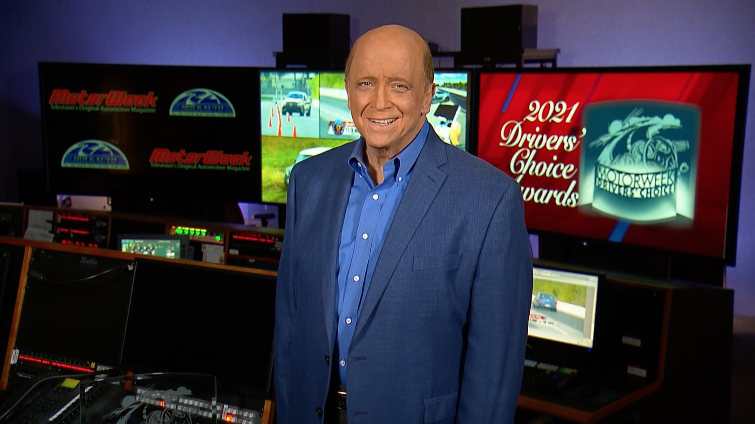 MotorWeek Host and Creator John Davis in the studio for the virtual announcement of the 2021 Drivers' Choice Awards. Davis calls the Mustang Mach-E -- the "Best of the Year" winner -- "the best total package of an electric vehicle that anyone has designed to date."
