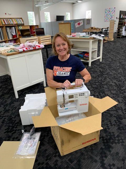 Shop owner, Jolene Fitch, gets ready for the Grand Opening of Finger Lakes Fabrics