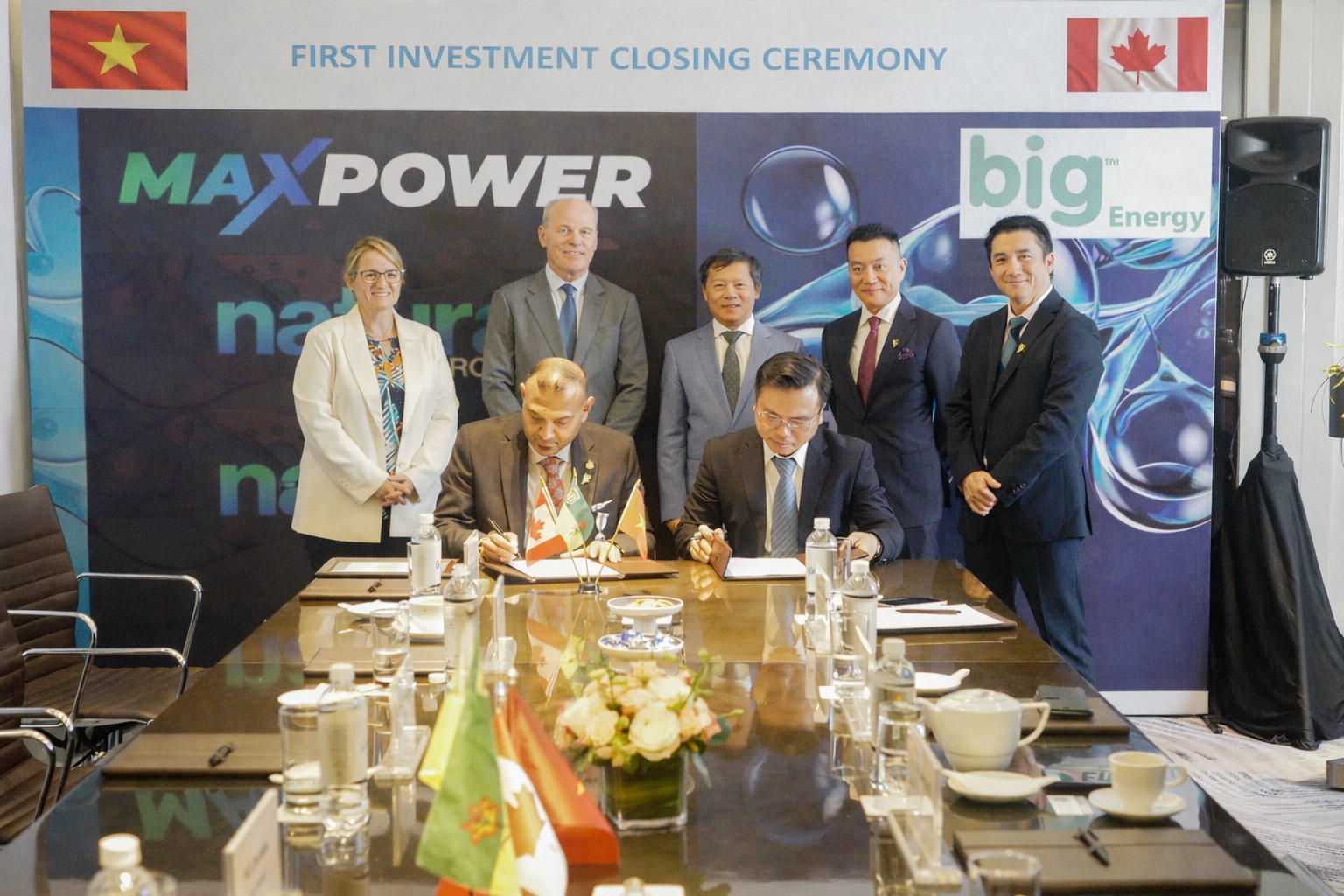 MAX Power CEO Ran Narayanasamy (front left) signs closing documents in Hanoi with Dr. Phung Khac Hoan (front right), General Director of Big Energy. Back row left to right: Emilie Carrier, Senior Trade Commissioner; Ambassador Jim Nickel; Bitexco Chairman Mr. Vu Quang Hoi; Mr. Ha Nguyen, Consulate General of Canada, Director of Saskatchewan Vietnam Office; Mr. Viet Tran, COO of Big Energy.