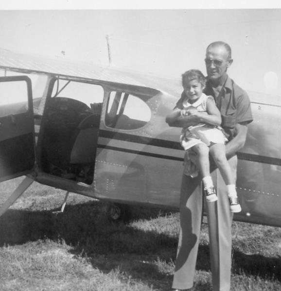 John Leonard, who purchased the family farm near Platteville, Colorado on April 6, 1951, and a member of the Flying Farmers group pictured with his granddaughter, Paula Carr during the summer of 1957. 