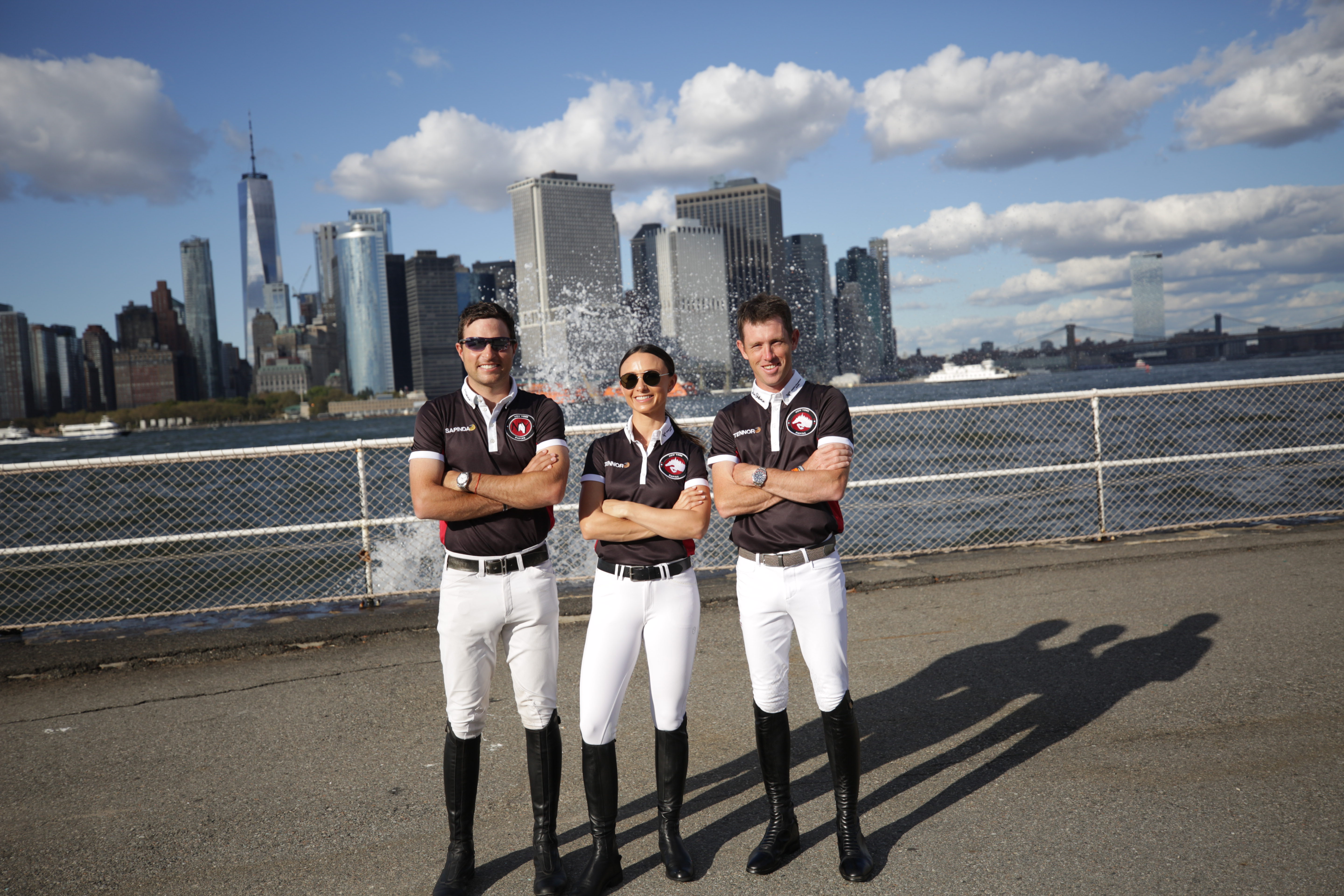 The New York Empire team for the Longines Global Champions Tour and Global Champions League in New York is Daniel Bluman, Georgina Bloomberg, and Scott Brash. Photo by Ashley Neuhof Photography