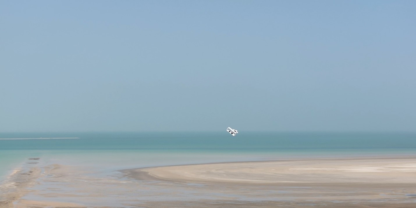 Subscale J-500 soaring above the sand and sea in UAE