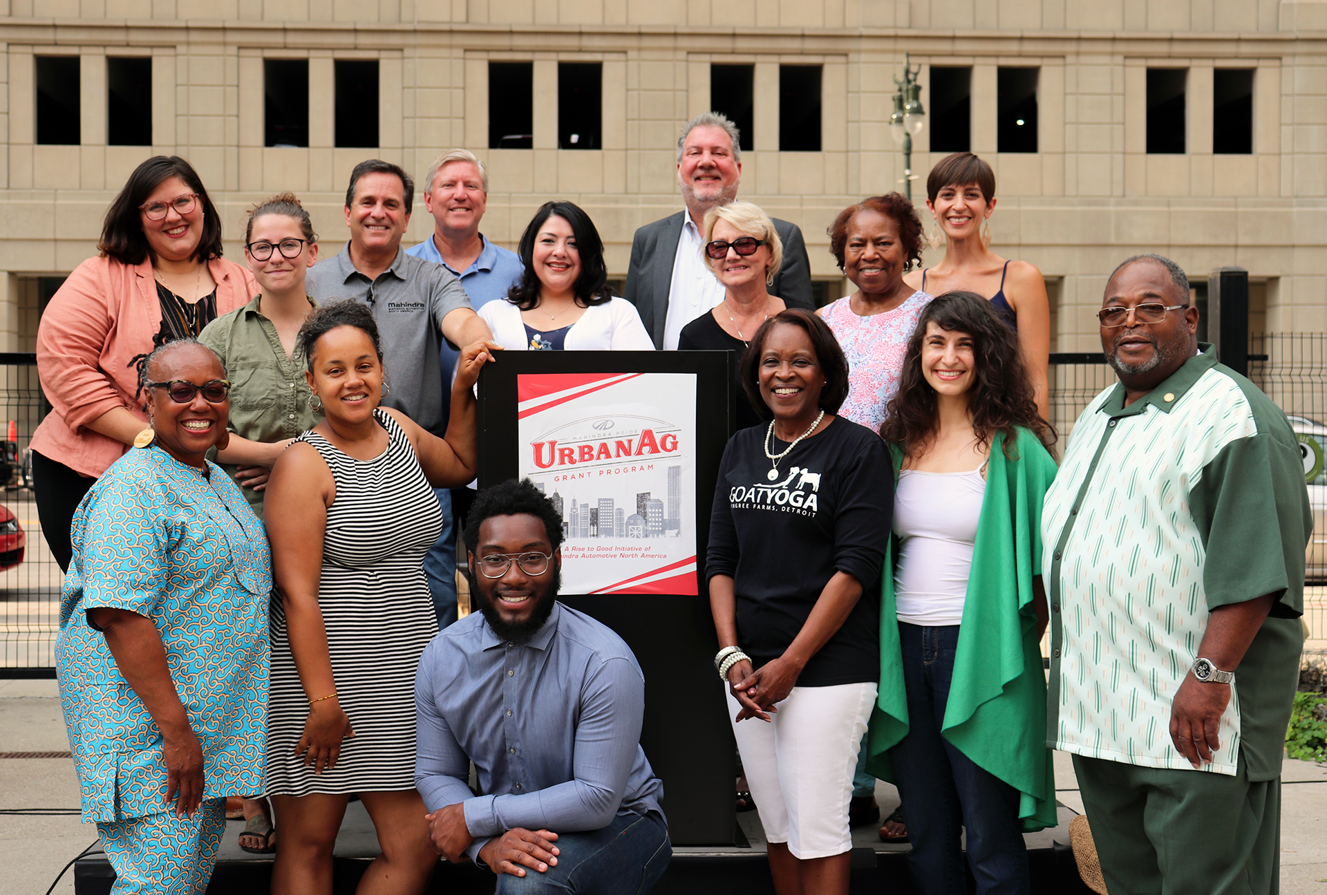 Mahindra Automotive North America 2019 Urban Agriculture grant recipients, from left to right: Samantha Farah, Edible Flint; Brittany Bradd, Neighbors Building Brightmoor; Rich Ansell, Vice President of Marketing at Mahindra Automotive North America; Michael Craig, Charles Drew Transition Center; Monica Tabares, Greening of Detroit; Rick Haas, President and CEO of Mahindra Automotive North America; Sue Banner, The Full Circle Foundation; Edith Floyd, Mt. Olivet Neighborhood Watch (Growing Joy); Angela Newsom, Boggs Educational Center; Jerry Hebron, Northend Christian CDC; Tee Rushdan, Keep Growing Detroit; Daniel A. Washington, Northwest Goldberg Cares; Juana Woodson, Pingree Farms; Kate Daughdrill, Burnside Farm; Mose Primus, Yorkshire Woods Community Organization