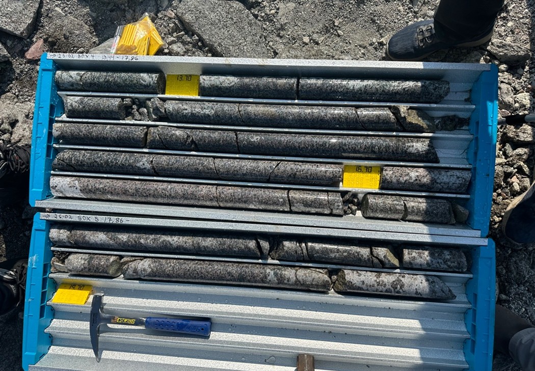 2025 Diamond Drill Hole drill core DDH25-02, close up showing mauve eudialyte in the kakortokite host