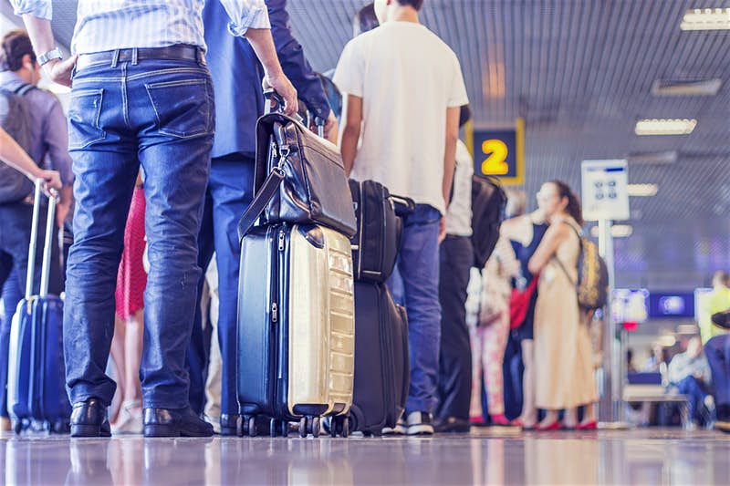 People standing in line at airport