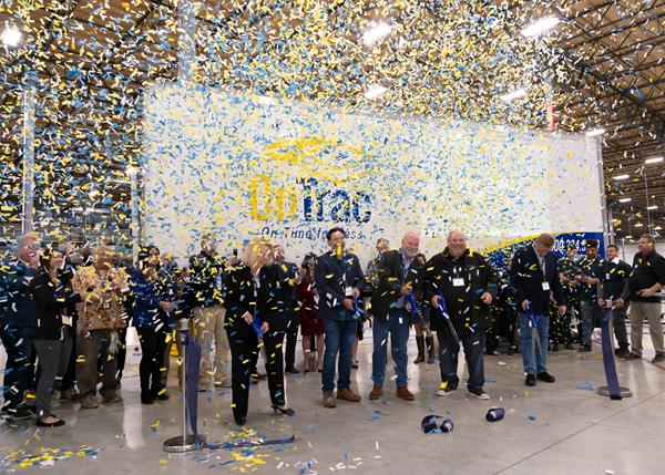 OnTrac leadership team and dignitaries cut grand opening ribbon at new facility
