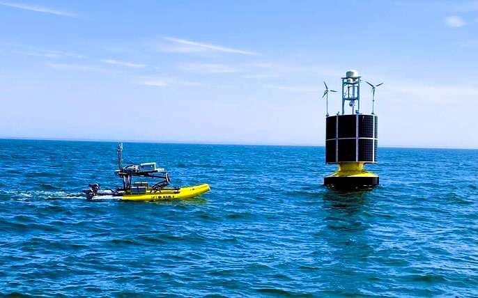 Image of Ocean Power Technologies PowerBuoy and WAM-V during sea trials.