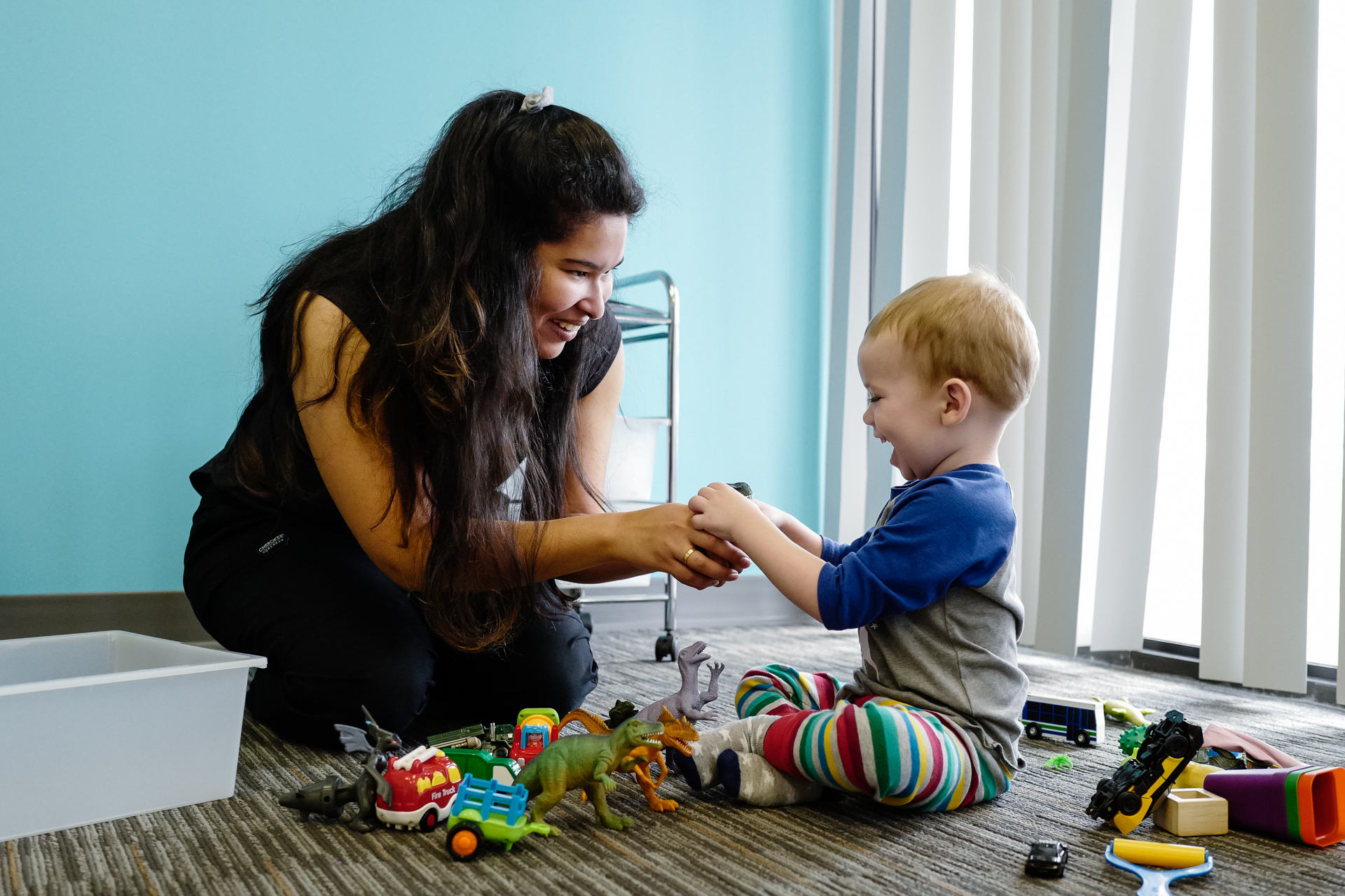 A therapist works on identifying items with a child at an InBloom Autism Services Learning Center.