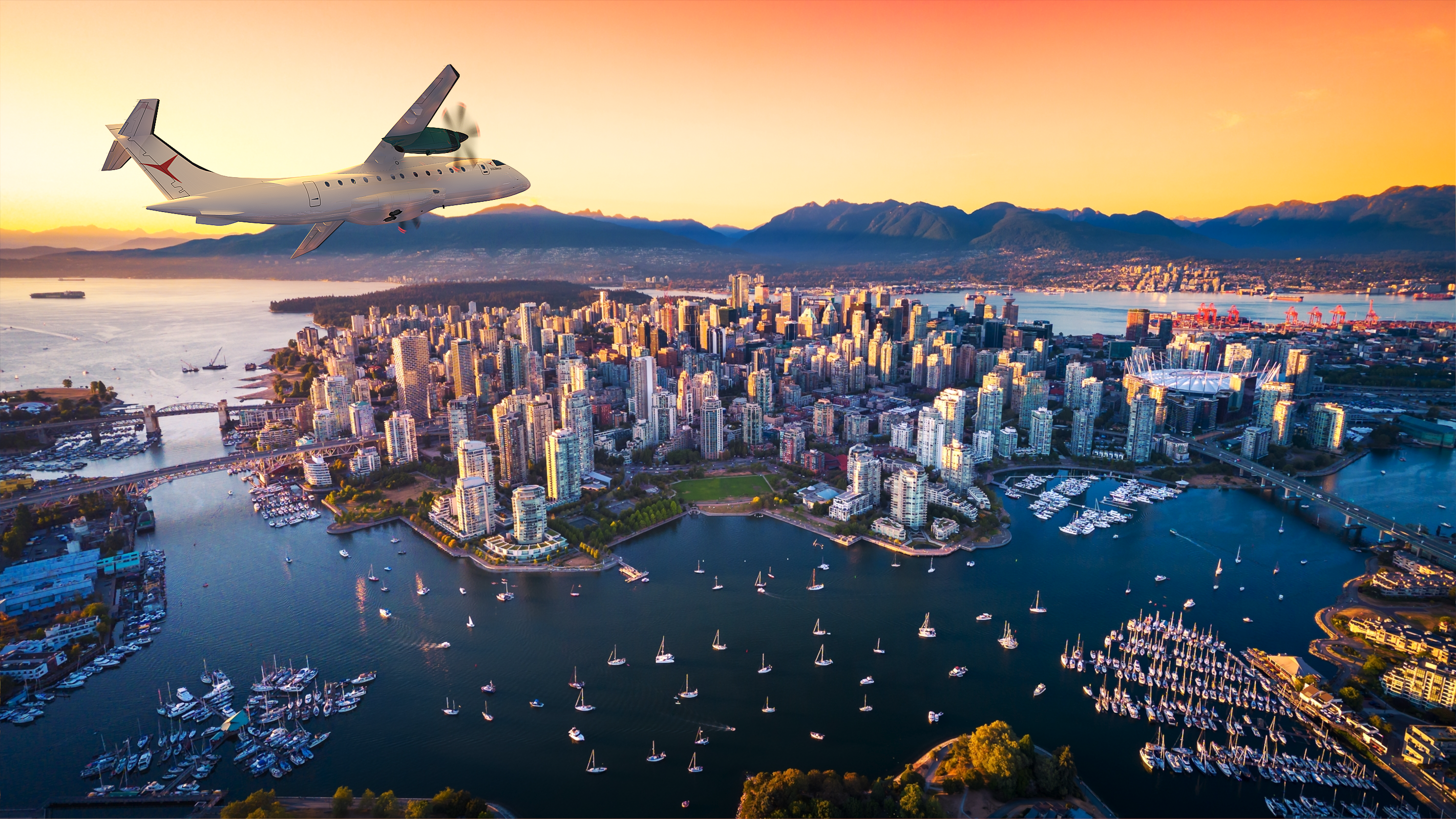 D328eco flying over Vancouver skyline