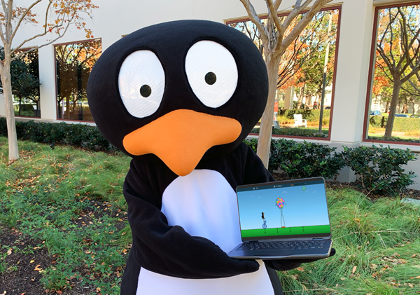 JiJi holds a laptop with the all-new version of MIND's flagship program, ST Math.