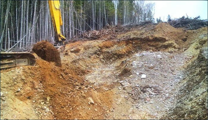 The trenching operation currently in progress at the Williams Brook property