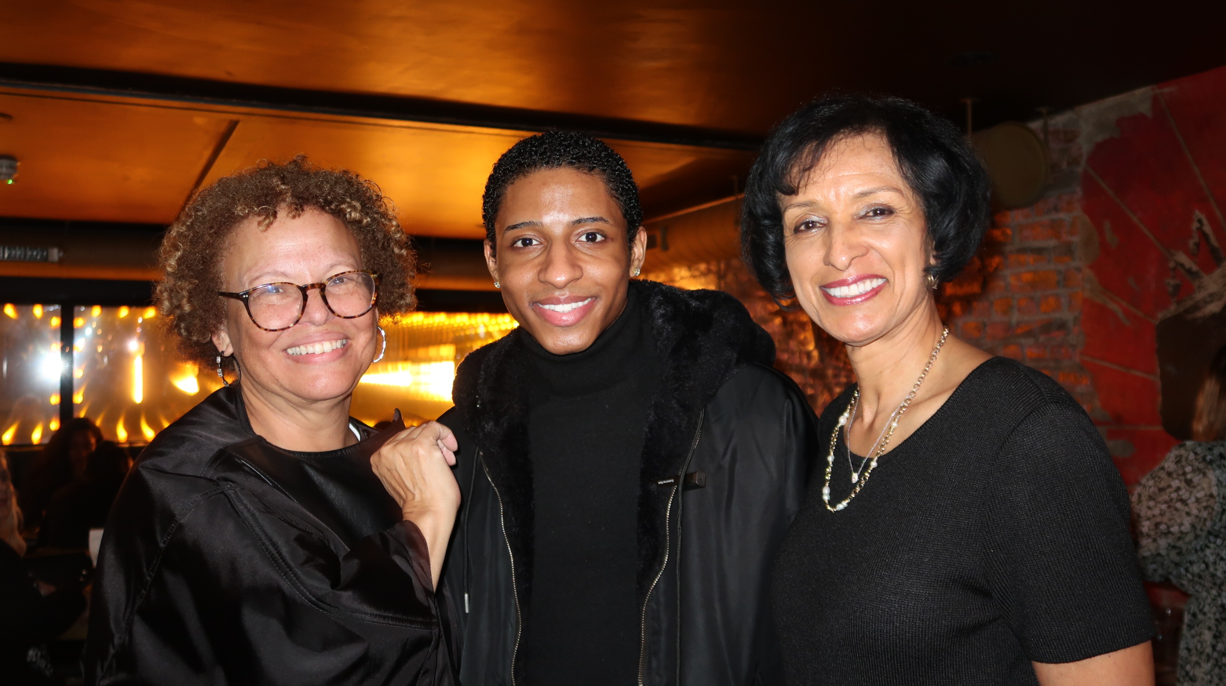Myles Frost mingles with Dr. Breaux and Debra Lee, the former Chairman and CEO of BET. Lee currently serves as a board member for Warner Bros. Discovery.