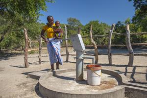Mother and Child Collecting Water in Zambia