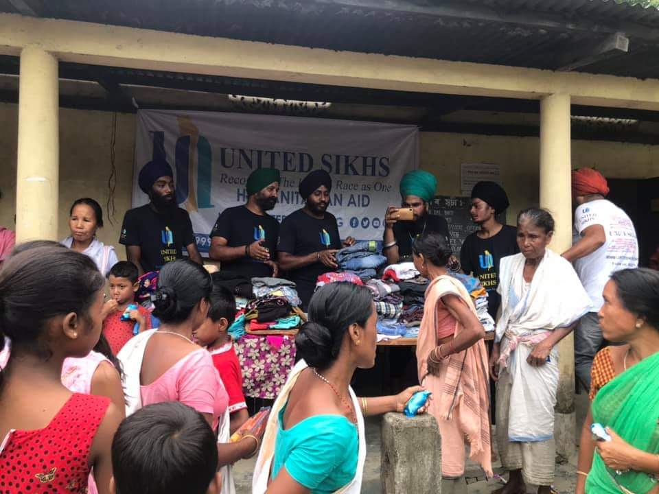 UNITED SIKHS Volunteers Distribute Clothing to Assam Flood Survivors