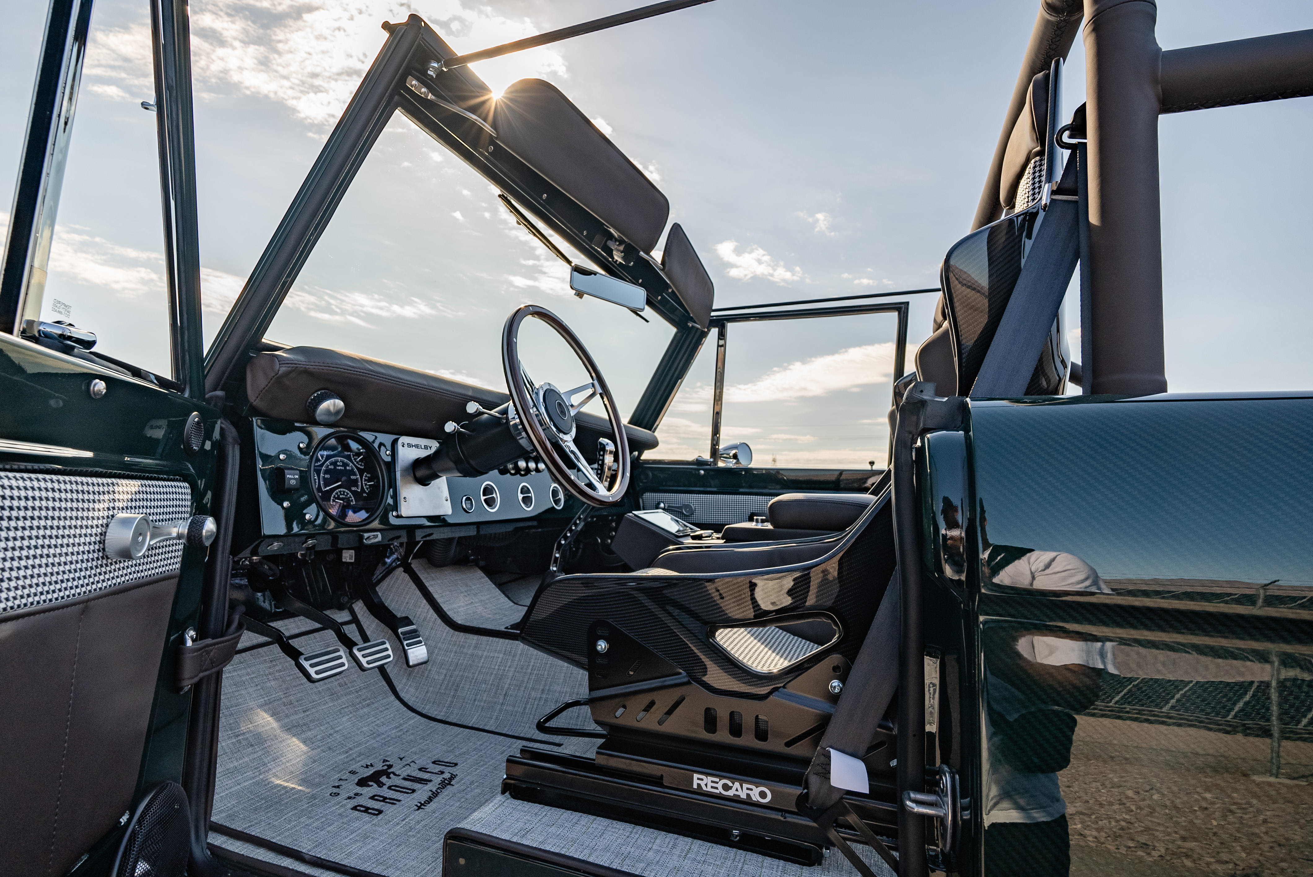 Recaro seats, a vintage Shelby GT350 steering wheel and contemporary gauges maintain the purposeful styling.