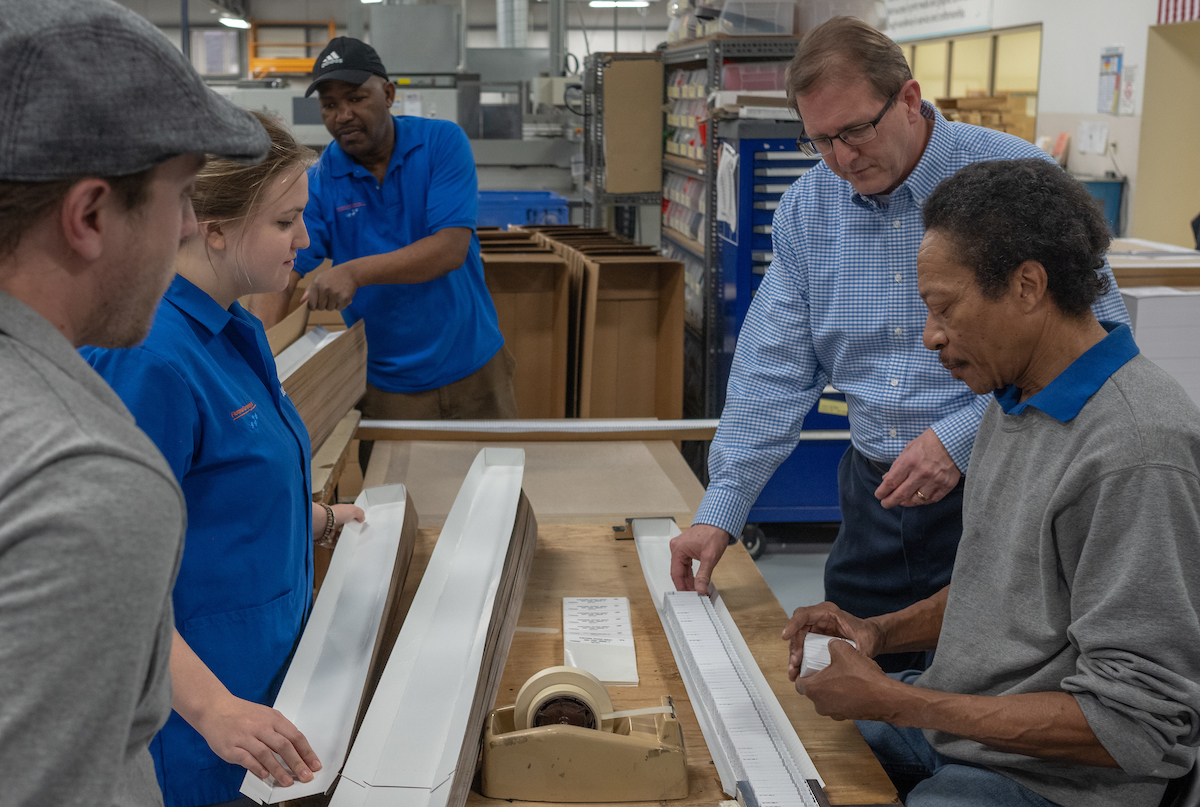 Joe Stone, Production Supervisor, Flottman Company, Pharmaceutical Inserts Production Performance Review with Team