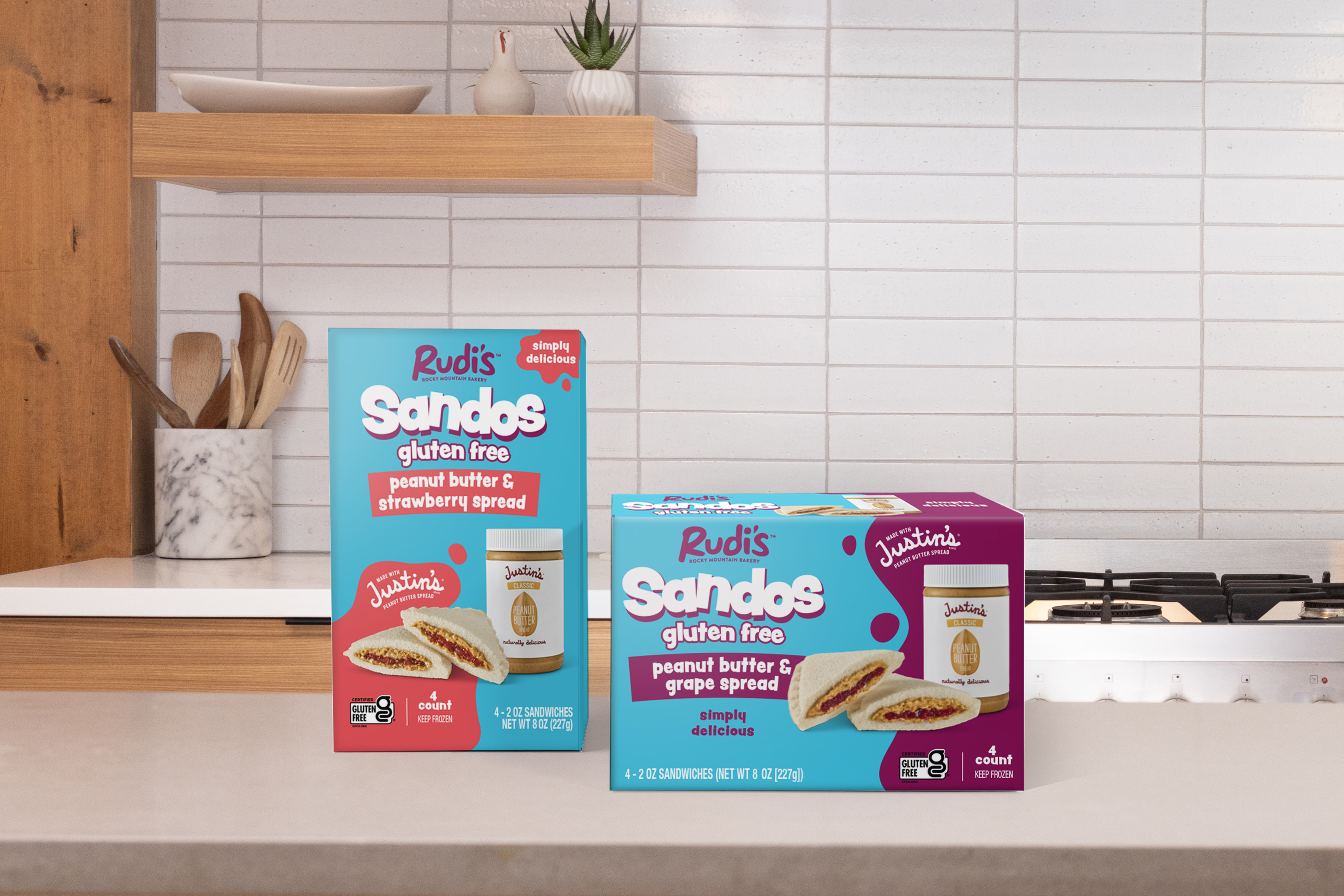 Packages of new gluten-free crustless peanut butter and jelly Sandos from Rudi's bakery on a white counter