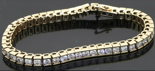 Heavy 14k yellow gold 10.29ct diamond line tennis bracelet. Sold for $5,600