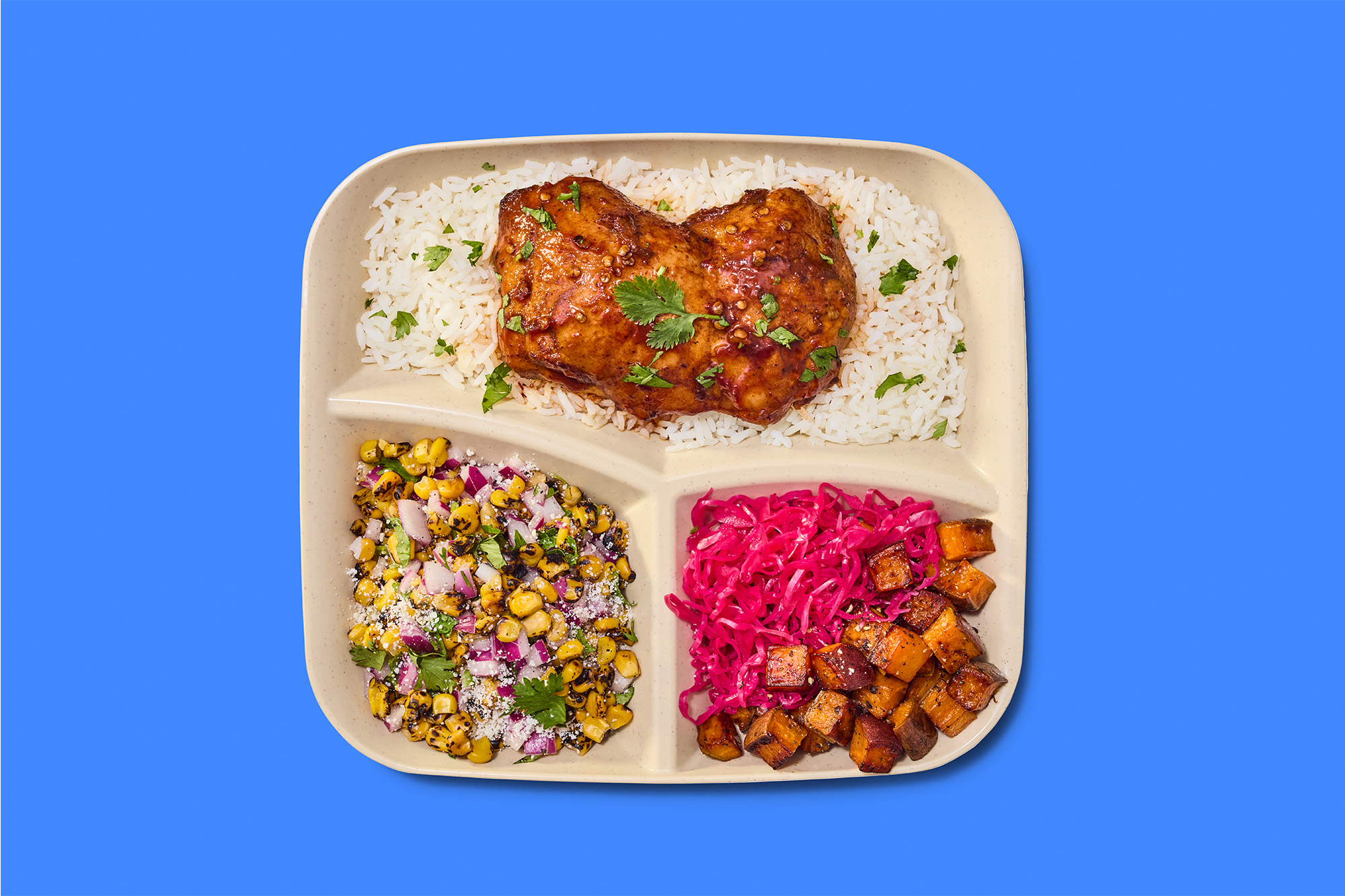 Just Salad’s returning Honey Adobo Chicken Market Plate pairs basmati rice and Honey Adobo Chicken with corn salsa, pickled red cabbage and sweet potatoes, served with Chipotle Vinaigrette and Hot Honey.