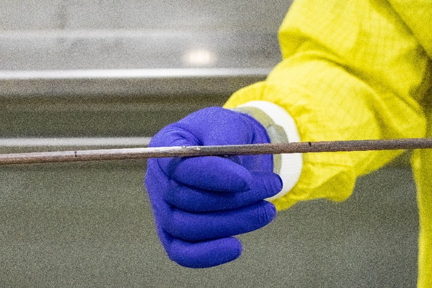 Close-up View of the Enriched Uranium-Zirconium Rod Post-Extrusion, still covered in the extrusion lubricant