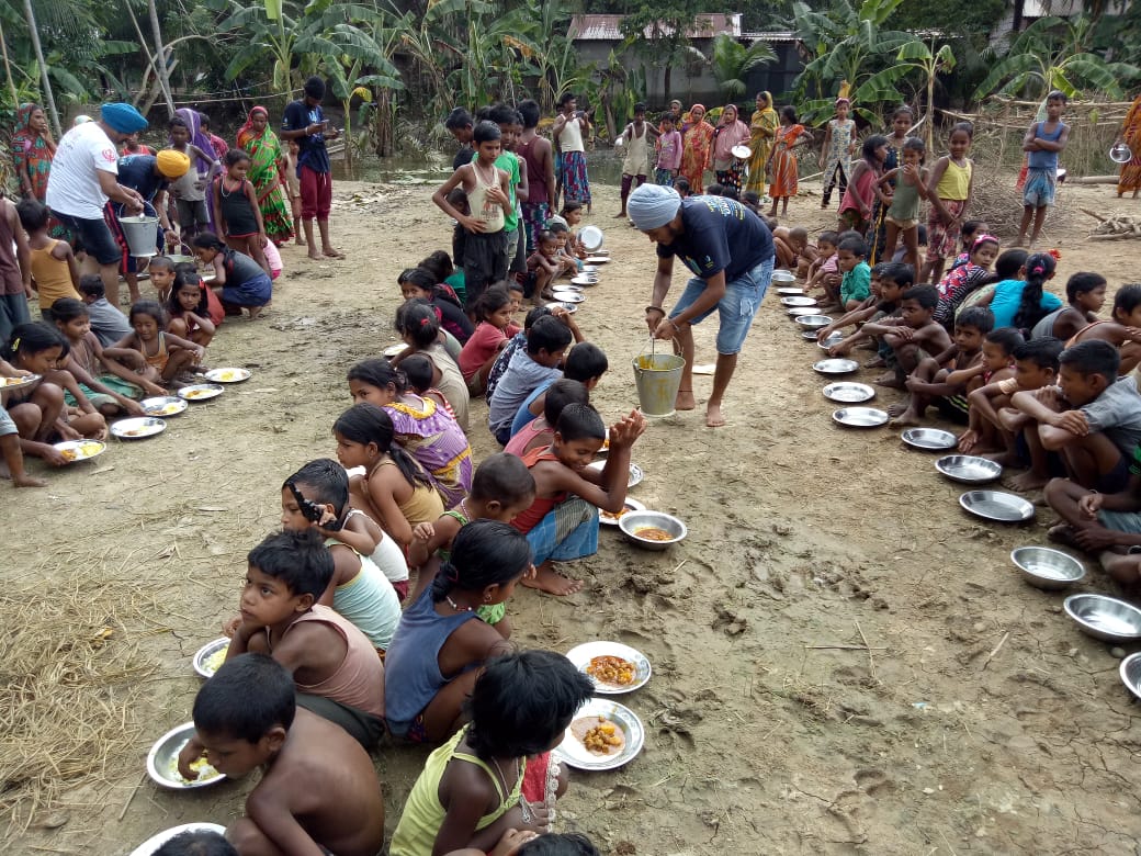 UNITED SIKHS Volunteers Serve Langar (Community Meal Service) to Assam Flood Survivors