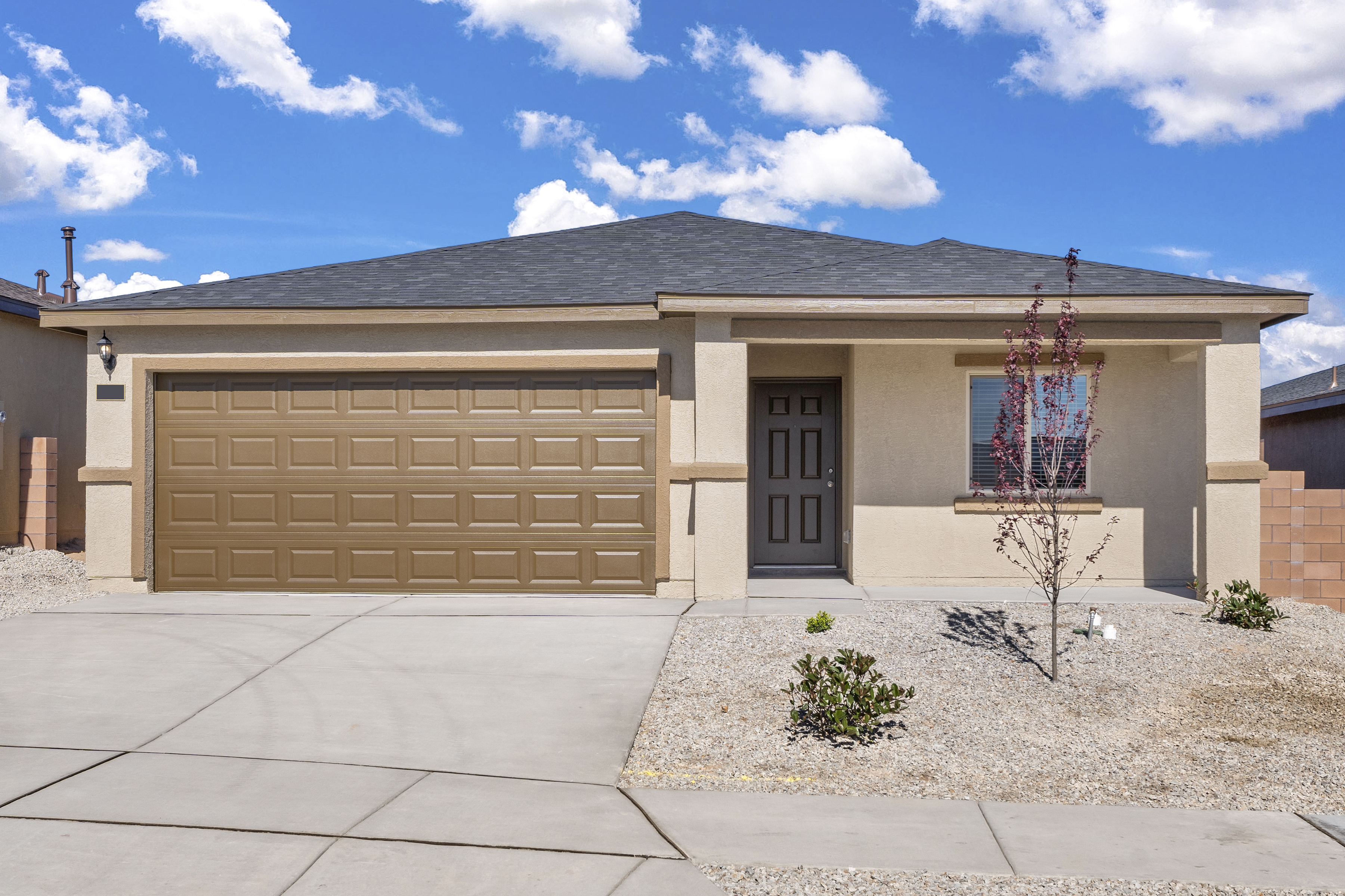 Photo of the one-story  Bisbee plan by LGI Homes in tan stucco with a lighter tan trim.