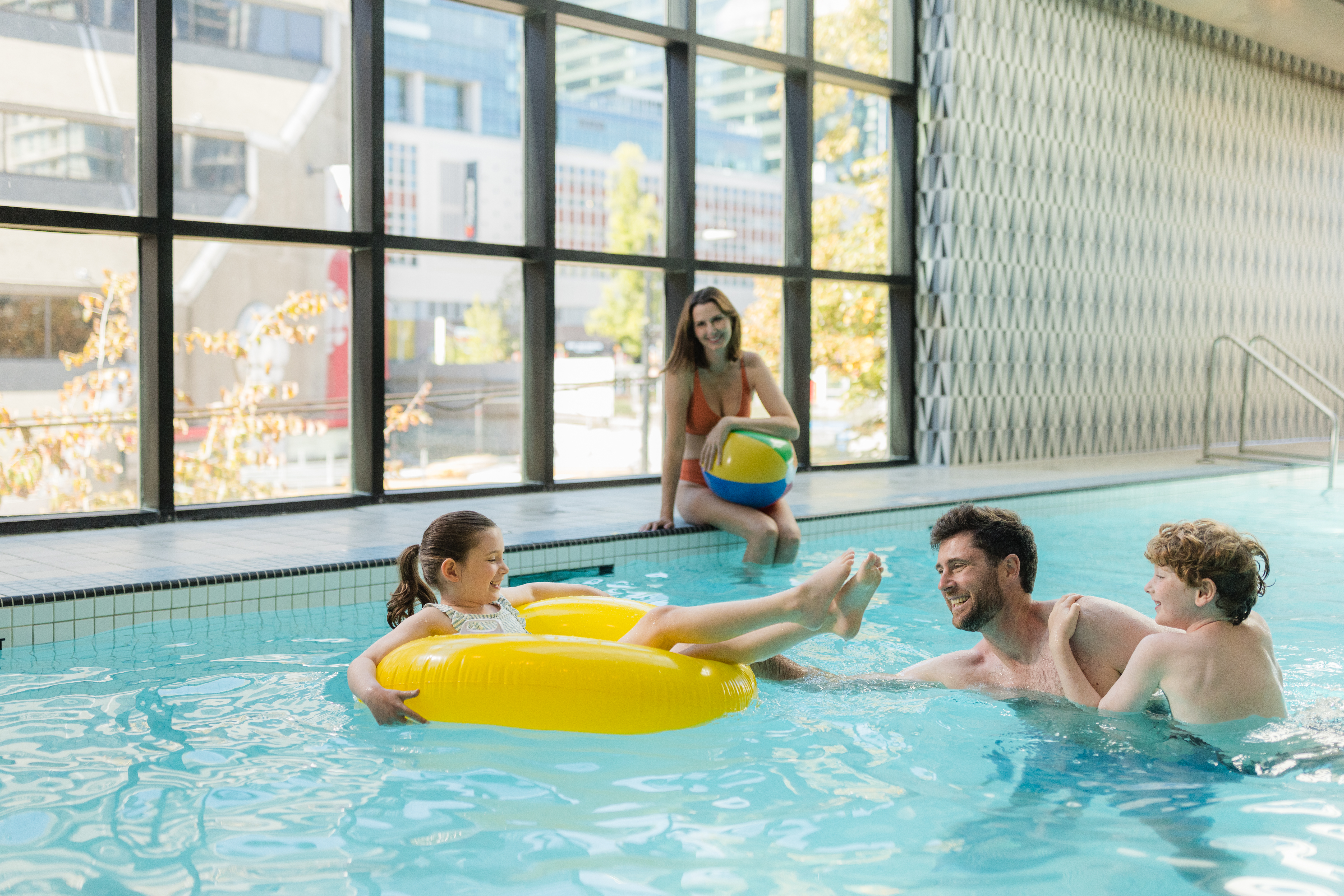 Family enjoying Sandman Signature Vancouver Downtown pool facilities