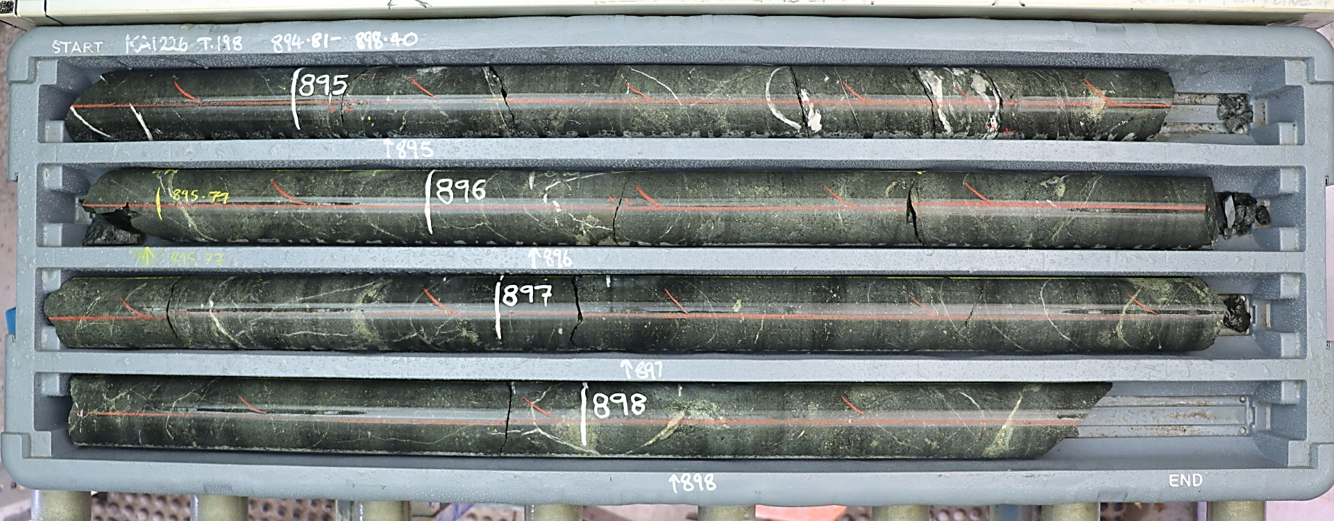 KAI226: Calc-potassic altered monzodiorite cemented breccia with lesser hydrothermal calcite-actinolite-chalcopyrite-pyrite cement from 3.2m interval grading 0.31g/t Au and 0.23% Cu.