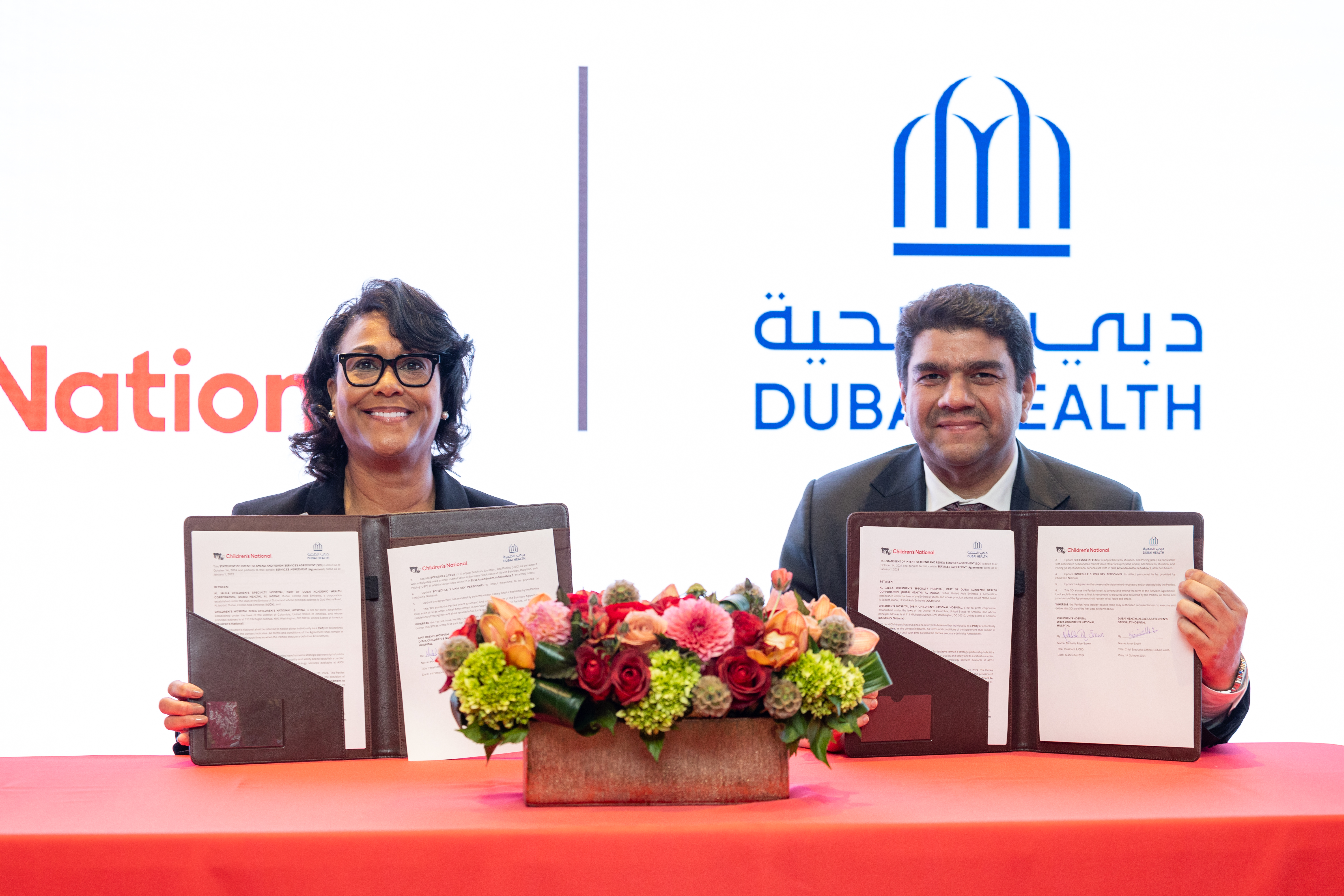 During a visit to Children's National Hospital, Dubai Health and Al Jalila Children's Specialty Hospital executives formalized a new partnership agreement with the pediatric hospital. (L to R): Michelle Riley-Brown, MHA, FACHE, Children's National President and CEO; Dr. Amer Sharif, chief executive officer of Dubai Health.