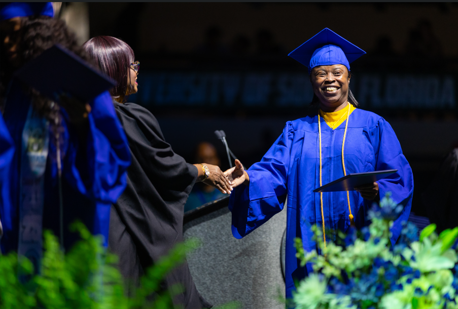 UMA Graduate Accepts Diploma