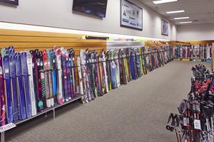 Image of hundreds of skis lined up and ready for purchase.