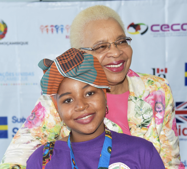 African stateswoman Graça Machel, pictured with a youth, is among the panelists for the joint panel by Children Believe and Graça Machel Trust. FDC – FUNDAÇÃO PARA O DESENVOLVIMENTO DA COMUNIDADE