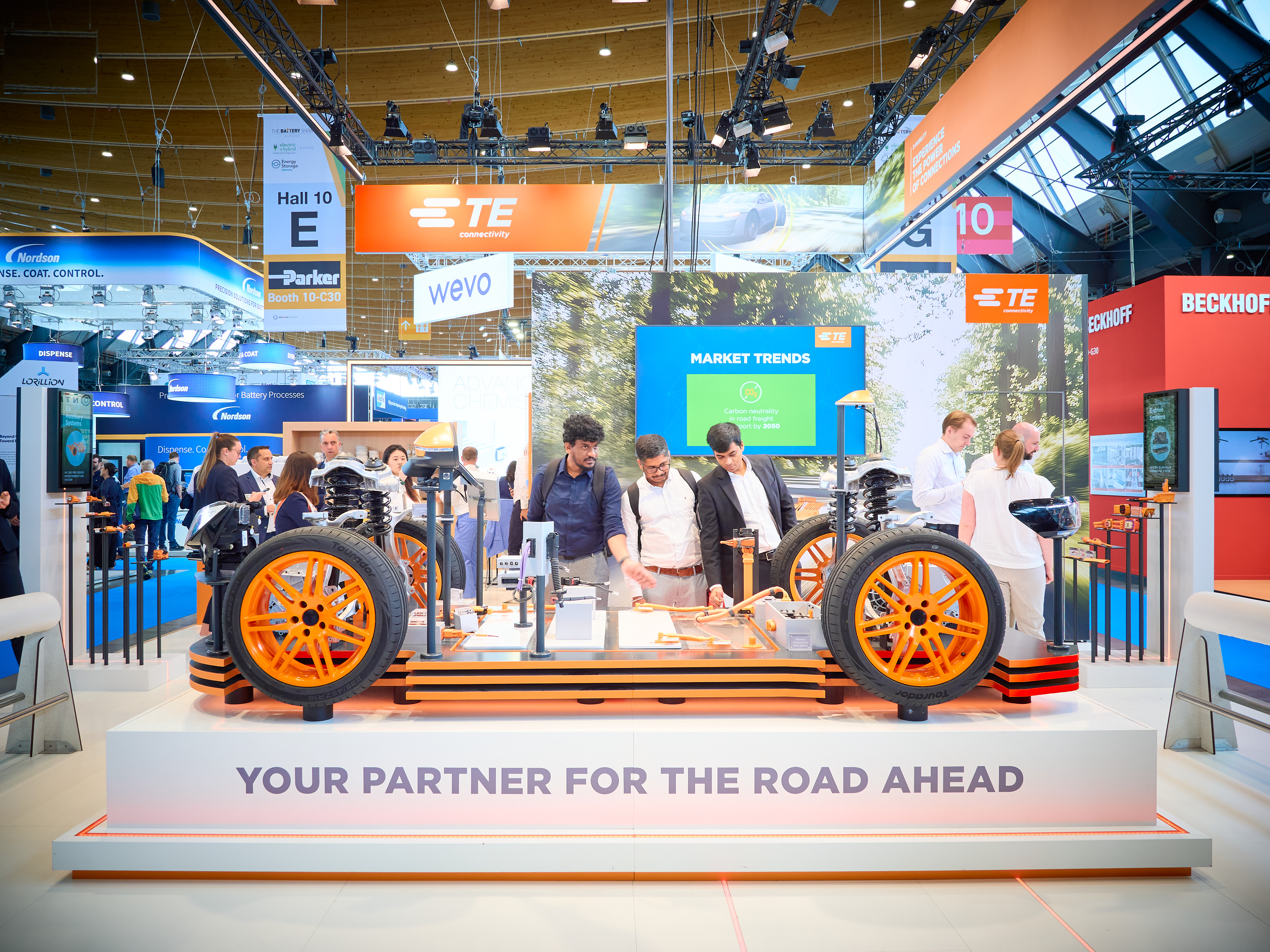 Attfinishees at the TE Connectivity booth at The Battery Show Europe 2025.