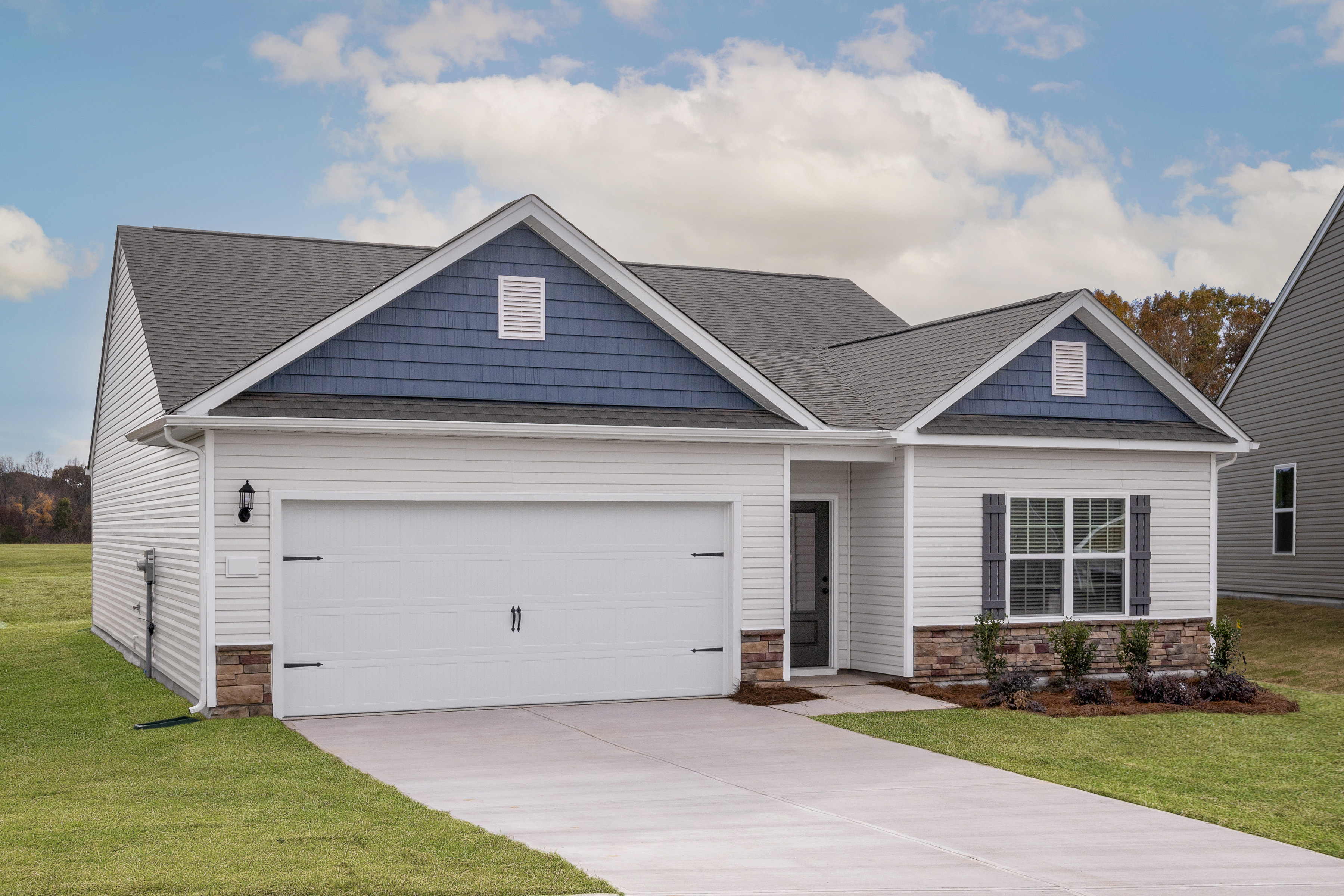 The Cary floor plan has beautiful exterior stone detailing with 3 bedrooms, 2 bathrooms and a 2-car garage.