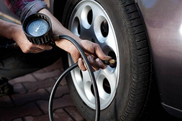 Tire makers recommend drivers measure tire pressures monthly