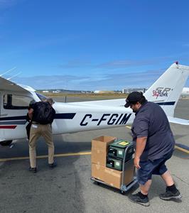 LifeLabs courier loading replacement supplies onto aircraft at YYJ
