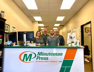 Minuteman Press, Columbia, Missouri. Pictured from left to right: Lorraine Hammock; Dave Wallace, Owner; Josh Thompson; and Brian Asbury.
