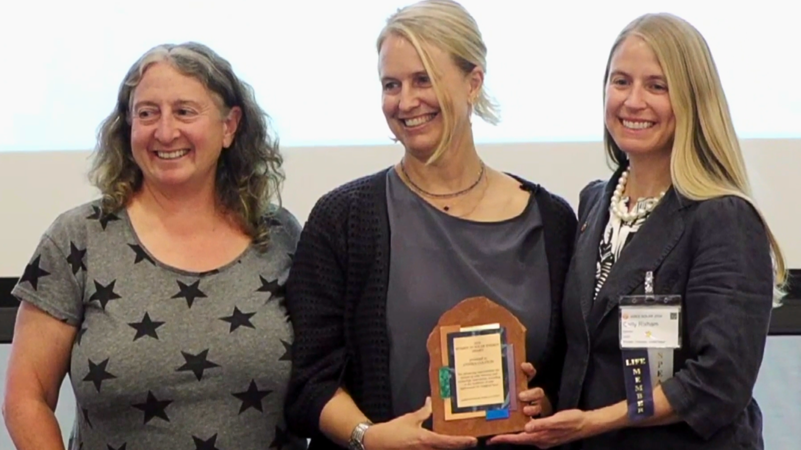 Annika Colston poses with her Women in Solar Energy Award at the ASES Banquet.