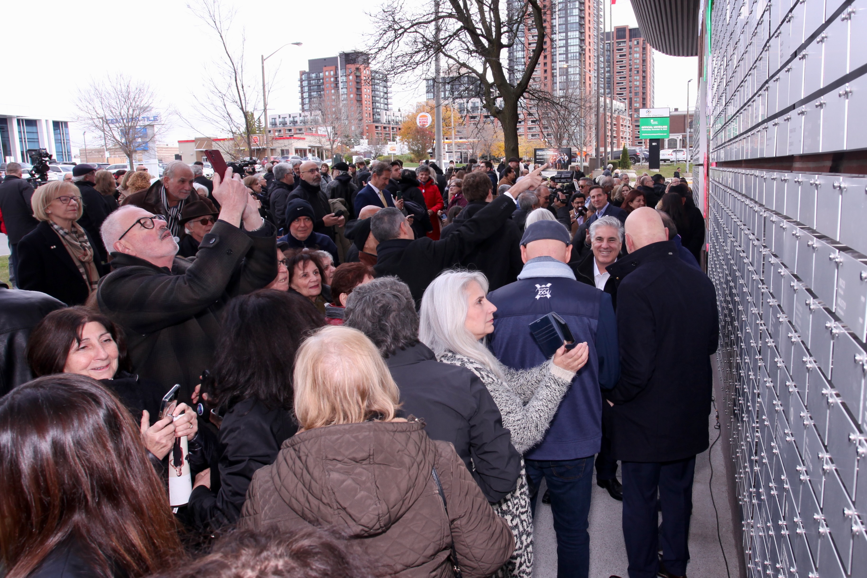 Crowd gathers at Italian Canadian Immigrant Tribute wall