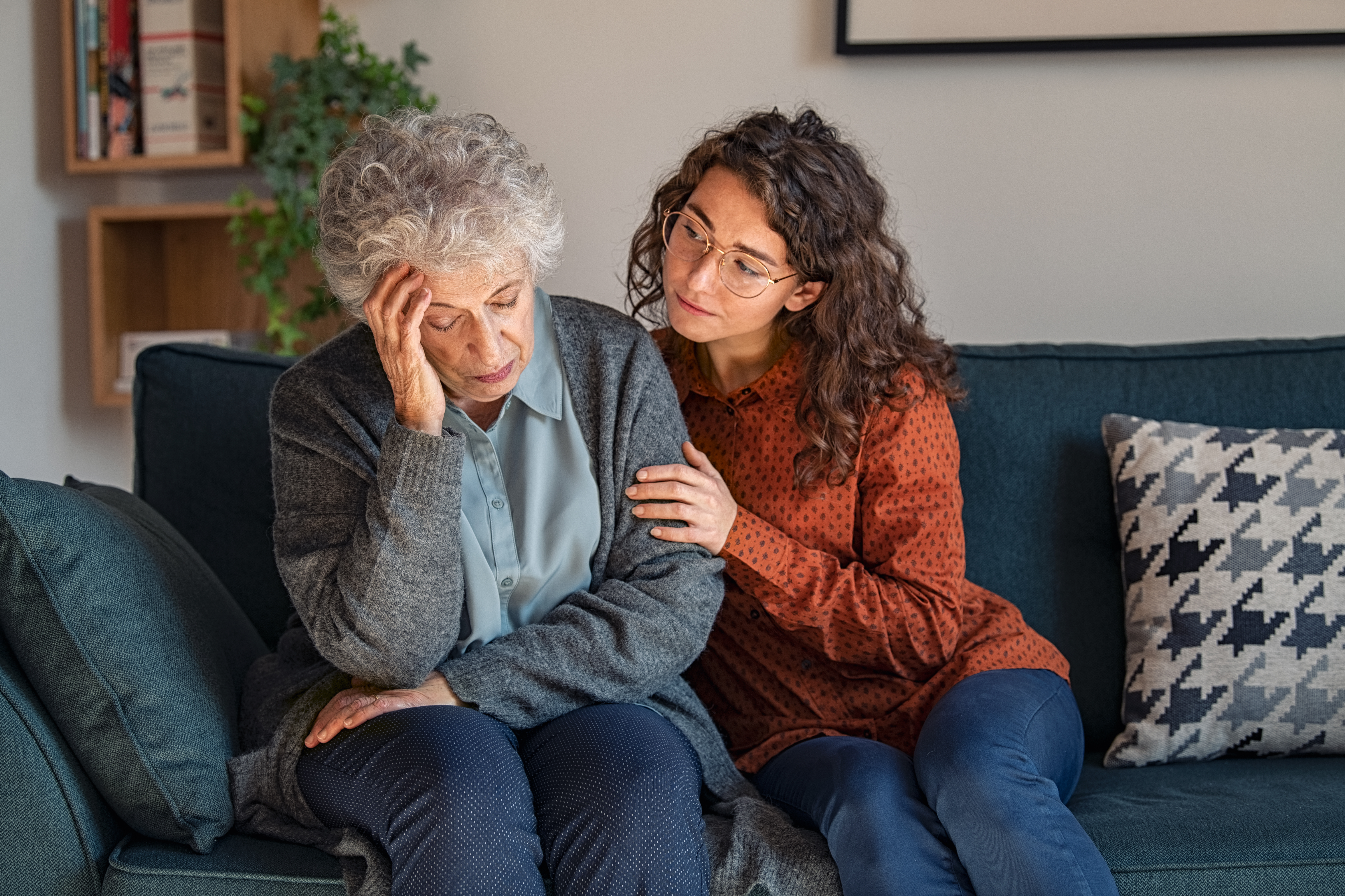 Worried Elderly Woman Consoled