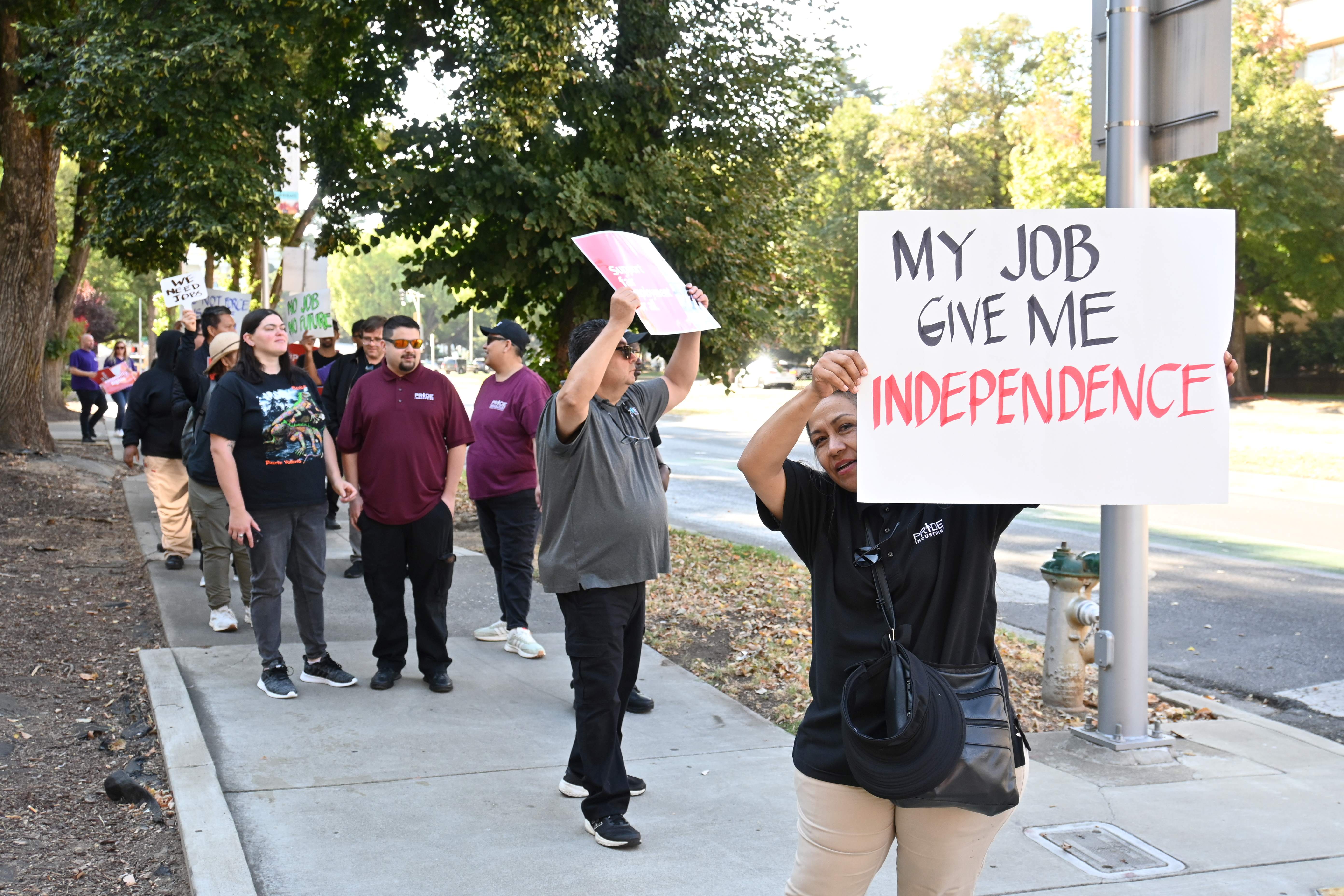 PRIDE Industries employees demonstrate in support of keeping their jobs  