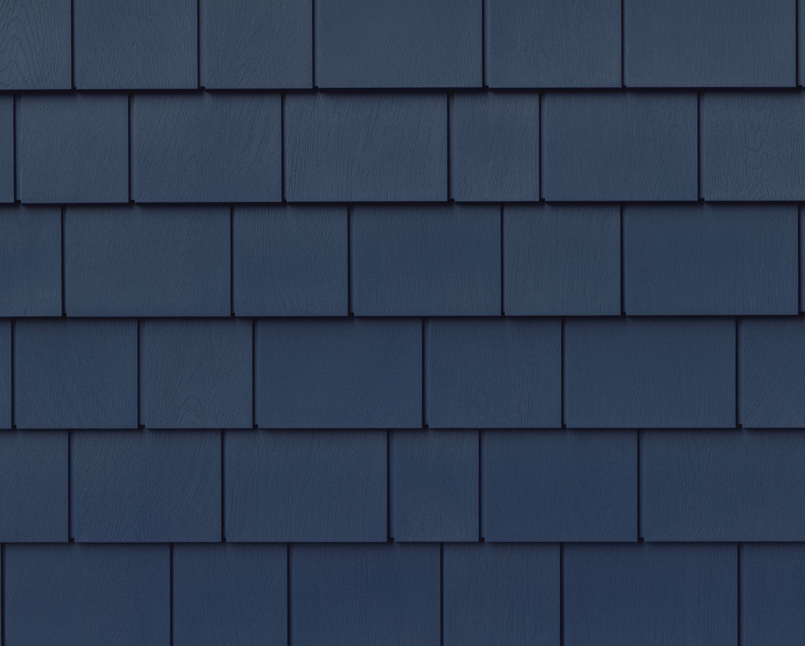 Now with a Miami-Dade Notice of Acceptance for hurricane zones, Cape Cod Perfection features an aesthetically pleasing 5” exposure, subtle wood texture with crisp, square edges, and the look of painted wood shakes. Colors include include Classic White, Ashwood Gray, Slate Gray, Wheat, and Mariner Blue (shown), 