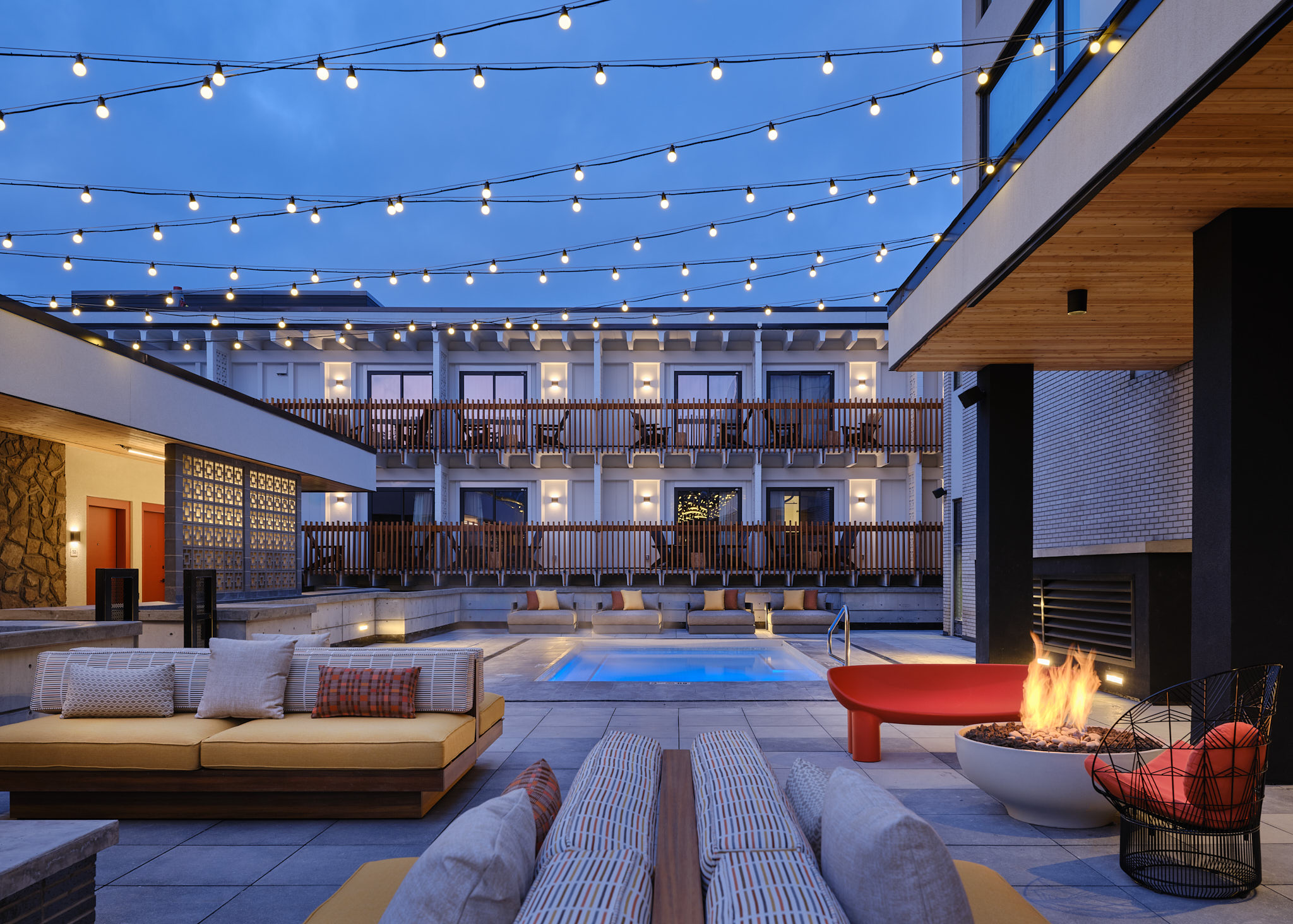 Guests can enjoy a year-round outdoor fireplace, heated patio stones and one of two hot tubs on Moxy Banff’s courtyard.