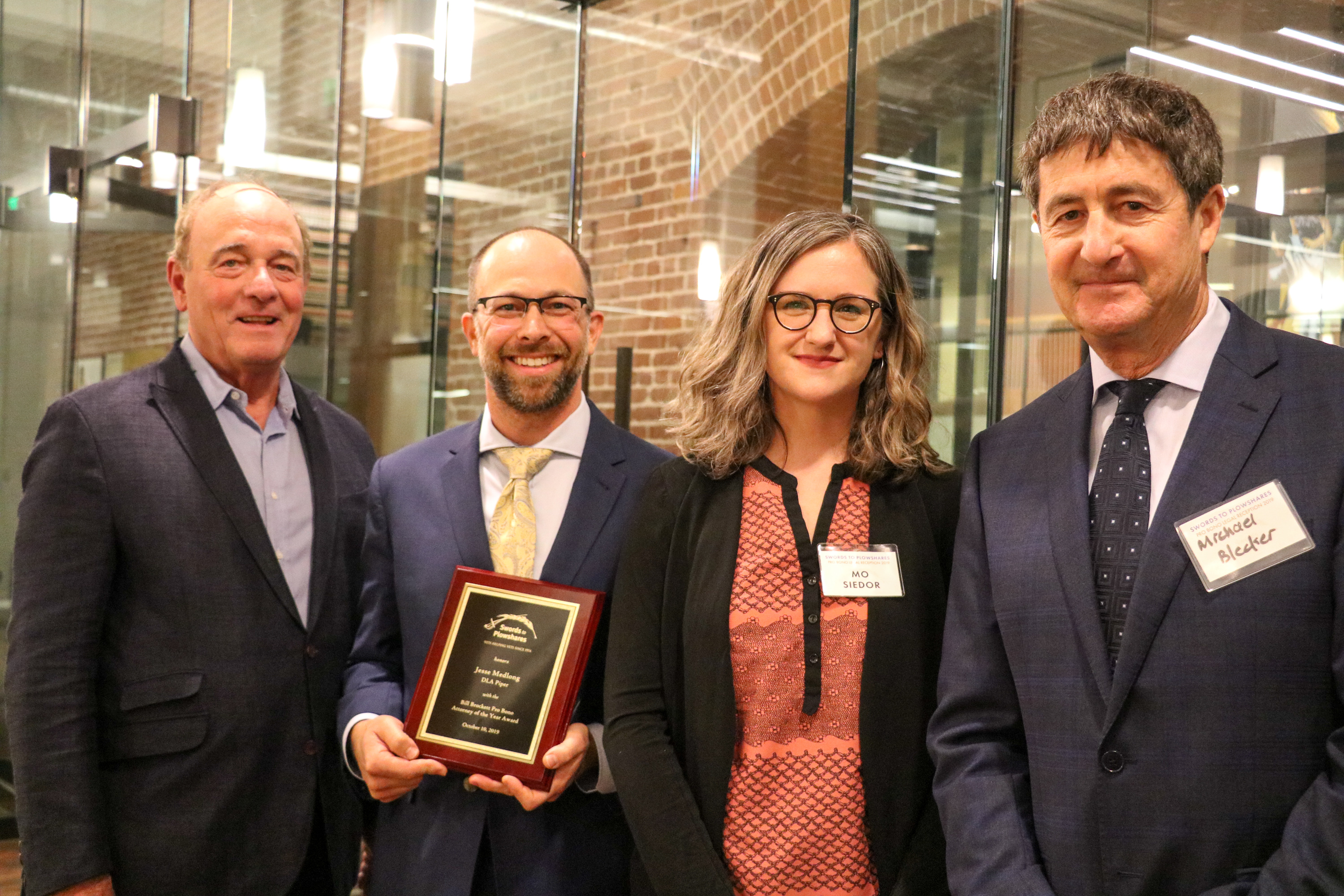 John Keker of Keker, Van Nest & Peters (far left), Jesse Medlong of DLA Paper (2nd from the left), Maureen "Mo" Siedor, Swords to Plowshares Legal Director (2nd from the right), and Michael Blecker, Swords to Plowshares Executive Director. 