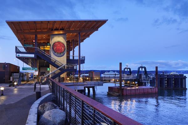 Exterior view of the new Mukilteo Multimodal Ferry Terminal in Mukilteo, Washington. The structural expression combines advanced energy and water conservation, and the longhouse-style shed roof allows for a full array of photovoltaic panels. Photo: © Benjamin Benschneider.