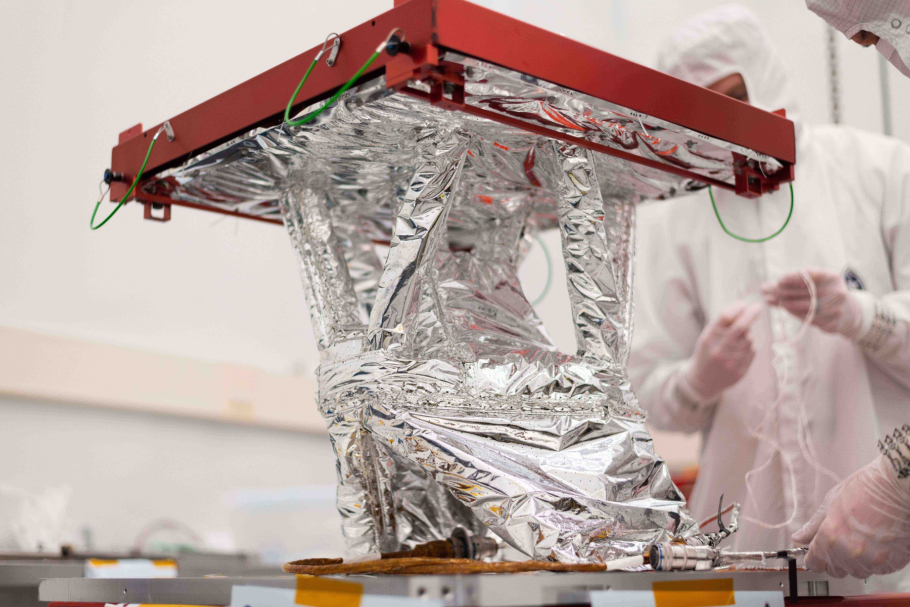 In this March 3 photo, Space Dynamics Laboratory engineers prepare the Mapping Imaging Spectrometer for Europa instrument Radiator Cryocooler Mount Assembly for NASA’s Europa Clipper mission for shipment from SDL to NASA’s Jet Propulsion Laboratory. The MISE RCM is a thermal management system that will be integrated on Europa Clipper—a spacecraft that will determine the habitability of Jupiter’s Galilean moon Europa. (Credit: Allison Bills/Space Dynamics Laboratory).